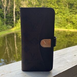 I’m selling a Louis Vuttion phone case! It has slots for you cards also!